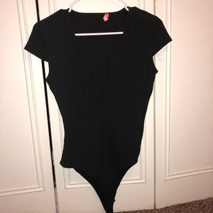 Black low cleavage body suit